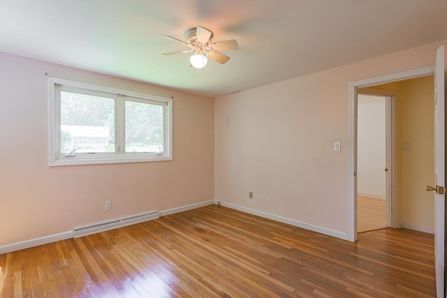 4 Appaloosa Ave, Pelham, NH 03076 - spare room featuring a baseboard heating unit, ceiling fan, and light wood-style floors