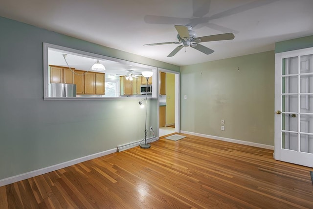 4 Appaloosa Ave, Pelham, NH 03076 - unfurnished living room featuring ceiling fan and wood finished floors