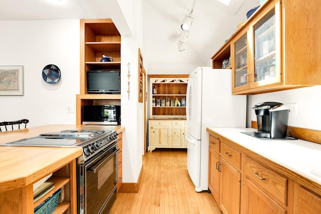 175 Middle Rd, Portsmouth, NH 03801 - kitchen with open shelves, black range with electric stovetop, stainless steel microwave, freestanding refrigerator, and light countertops