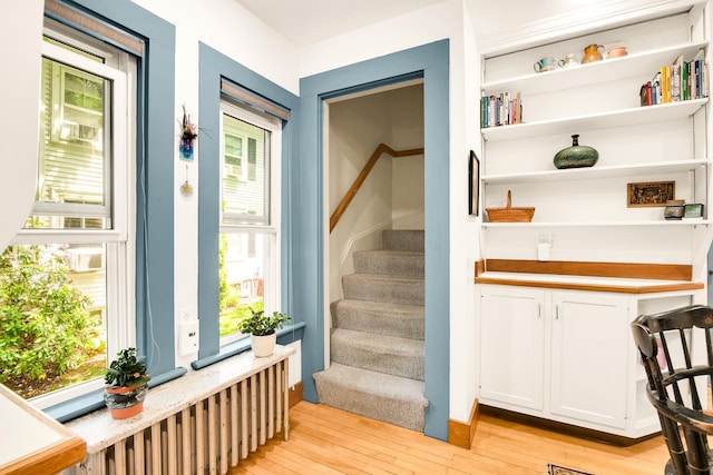 175 Middle Rd, Portsmouth, NH 03801 - staircase featuring wood-type flooring and radiator heating unit