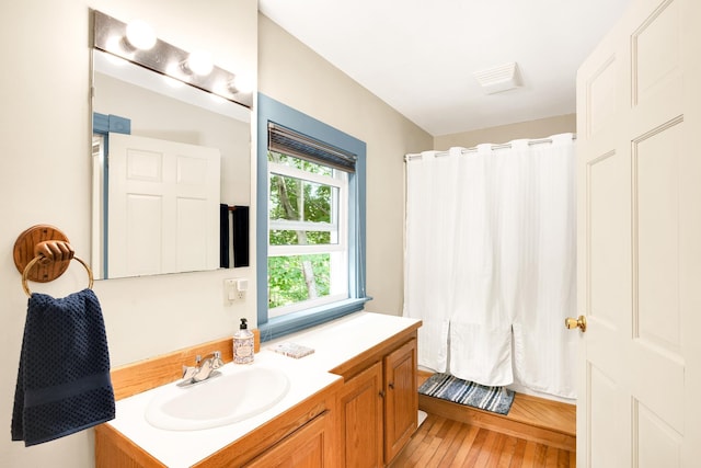 175 Middle Rd, Portsmouth, NH 03801 - full bath with vanity, wood finished floors, and a shower with shower curtain