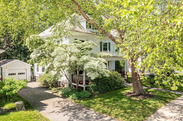 175 Middle Rd, Portsmouth, NH 03801 - view of property hidden behind natural elements with an outbuilding, driveway, and a detached garage