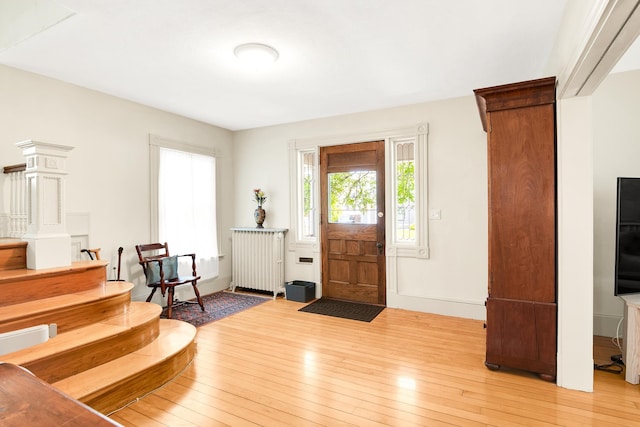 175 Middle Rd, Portsmouth, NH 03801 - entrance foyer featuring radiator heating unit and light wood finished floors