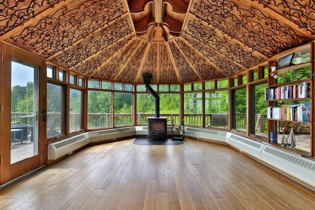 465 Pennell Rd, Chester, VT 05143 - unfurnished sunroom featuring a wood stove and hardwood / wood-style floors
