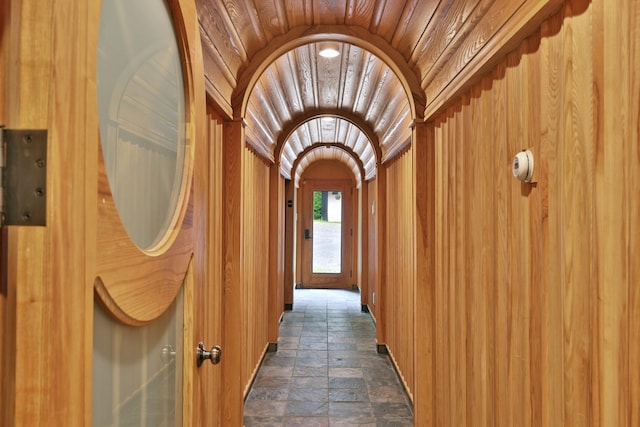 465 Pennell Rd, Chester, VT 05143 - corridor featuring stone tile floors, lofted ceiling, wood ceiling, and arched walkways