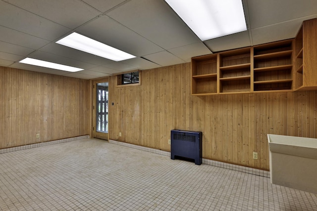 465 Pennell Rd, Chester, VT 05143 - spare room with radiator heating unit, wooden walls, and a paneled ceiling