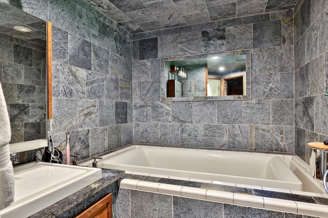 465 Pennell Rd, Chester, VT 05143 - full bathroom with tile walls, a garden tub, and vanity