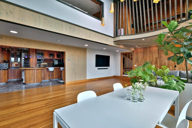 465 Pennell Rd, Chester, VT 05143 - dining space featuring wooden walls, wood finished floors, and recessed lighting