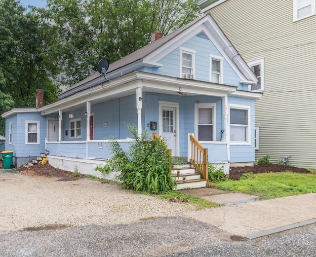 43AB River St, Rochester, NH 03867 - view of front facade featuring a chimney and covered porch
