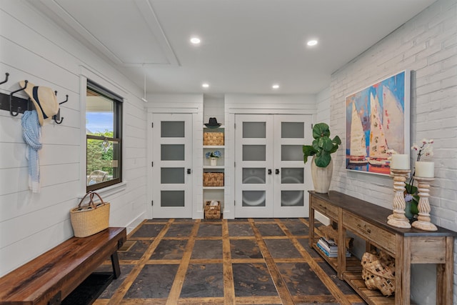 1549 Hinesburg Rd, South Burlington, VT 05403 - entryway featuring brick wall and recessed lighting