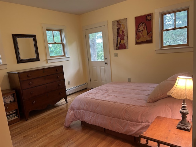 11 Morrison Ave, Meredith, NH 03253 - bedroom with a baseboard heating unit and light wood finished floors