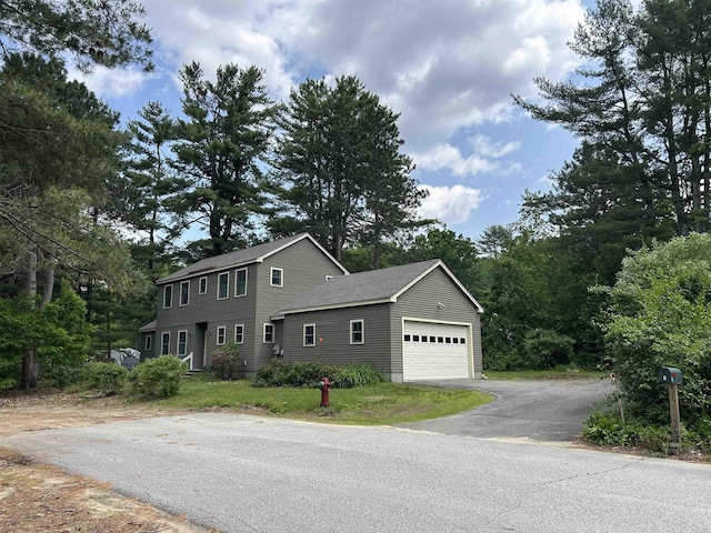 11 Morrison Ave, Meredith, NH 03253 - view of front of home featuring asphalt driveway and a garage