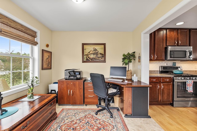 42 Leddy Dr, Epping, NH 03042 - office area with healthy amount of natural light and light wood-style flooring