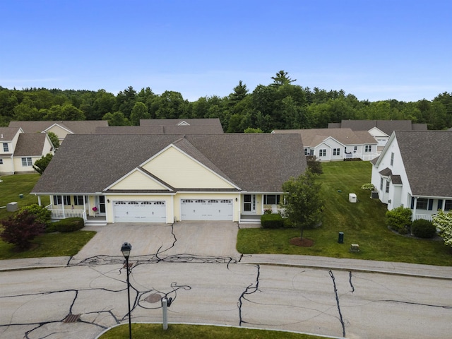 42 Leddy Dr, Epping, NH 03042 - view of front facade featuring driveway, a garage, a front lawn, and a shingled roof
