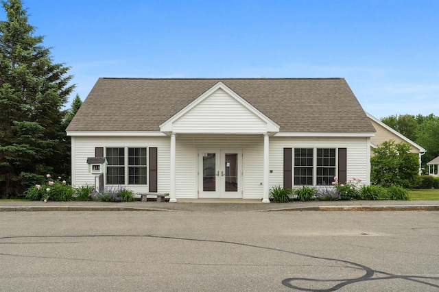 42 Leddy Dr, Epping, NH 03042 - view of front of house featuring french doors and roof with shingles