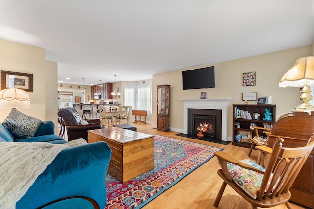 42 Leddy Dr, Epping, NH 03042 - living room with wood finished floors and a fireplace with flush hearth