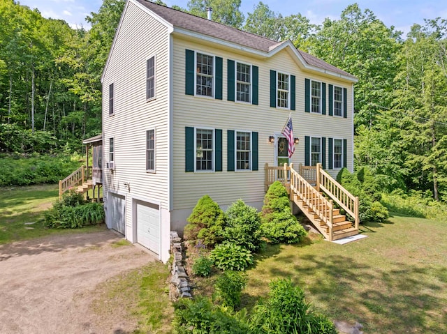 202 Cherry Valley Rd, Alton, NH 03810 - colonial home with dirt driveway, an attached garage, and a front yard
