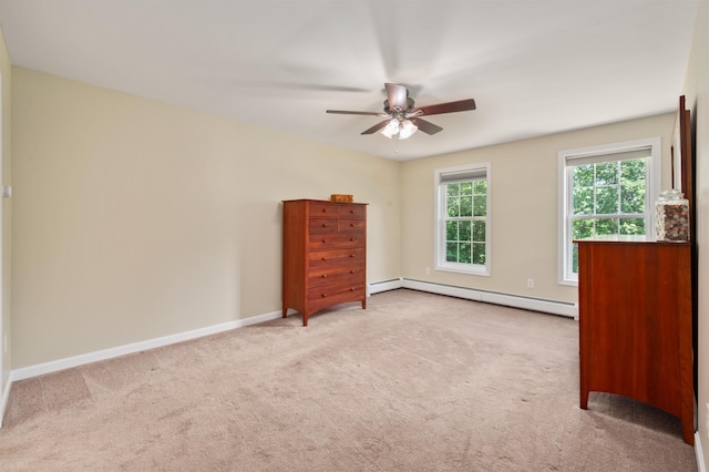 202 Cherry Valley Rd, Alton, NH 03810 - unfurnished bedroom featuring a baseboard heating unit, carpet floors, and ceiling fan