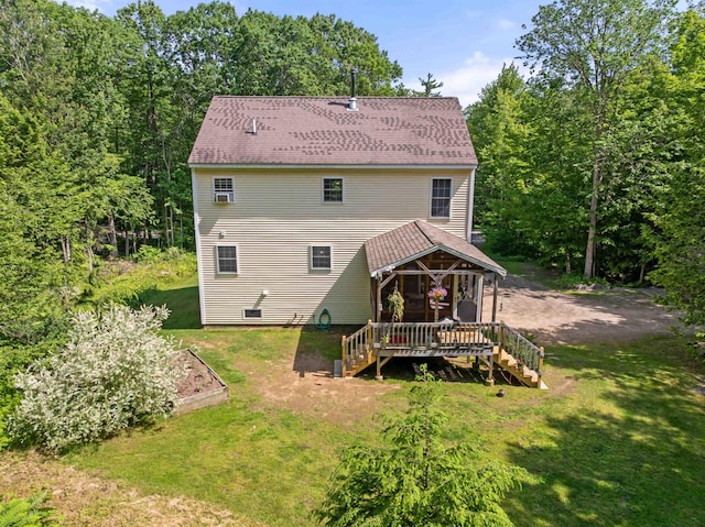 202 Cherry Valley Rd, Alton, NH 03810 - back of property featuring stairway, a vegetable garden, a wooden deck, and a lawn