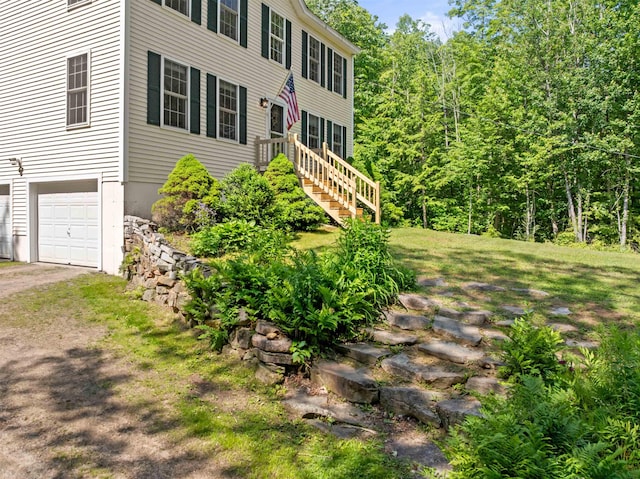 202 Cherry Valley Rd, Alton, NH 03810 - colonial house with a garage, driveway, and a view of trees