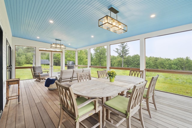 88 Stonehouse Rd, New London, NH 03257 - sunroom / solarium featuring a chandelier, outdoor dining area, and view of wooded area