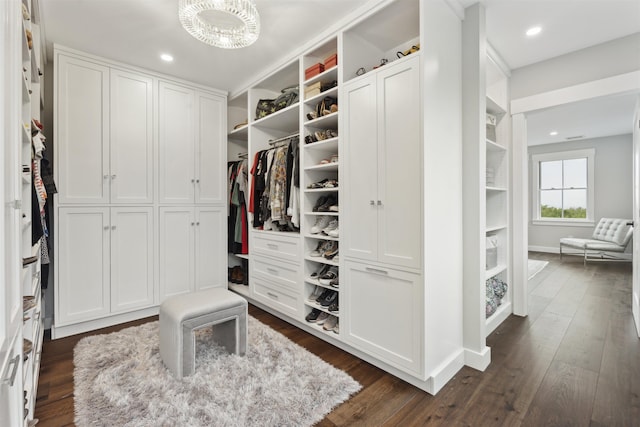 88 Stonehouse Rd, New London, NH 03257 - walk in closet with dark wood-style floors and a chandelier