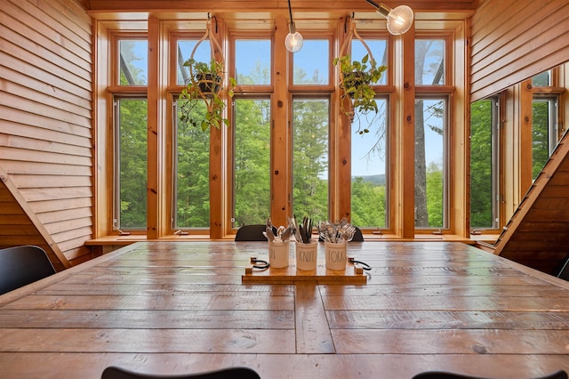812 Airport Rd, Fayston, VT 05660 - dining space with wood walls and plenty of natural light
