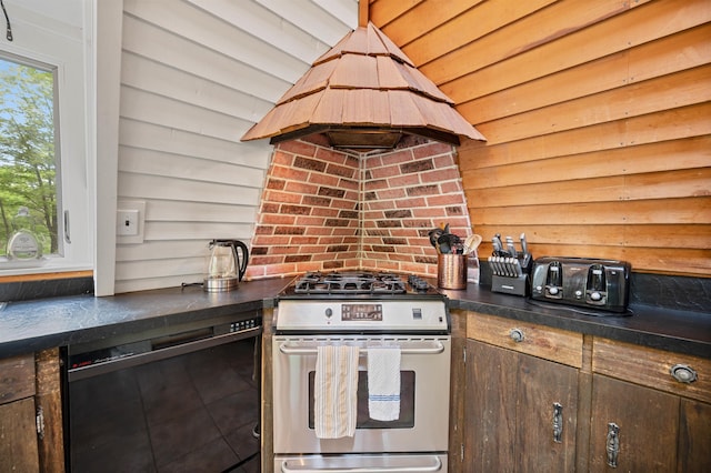 812 Airport Rd, Fayston, VT 05660 - kitchen featuring stainless steel gas stove, black dishwasher, island exhaust hood, dark countertops, and wooden walls