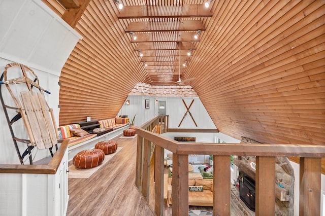 812 Airport Rd, Fayston, VT 05660 - interior space featuring wood finished floors, a glass covered fireplace, vaulted ceiling, and wooden ceiling