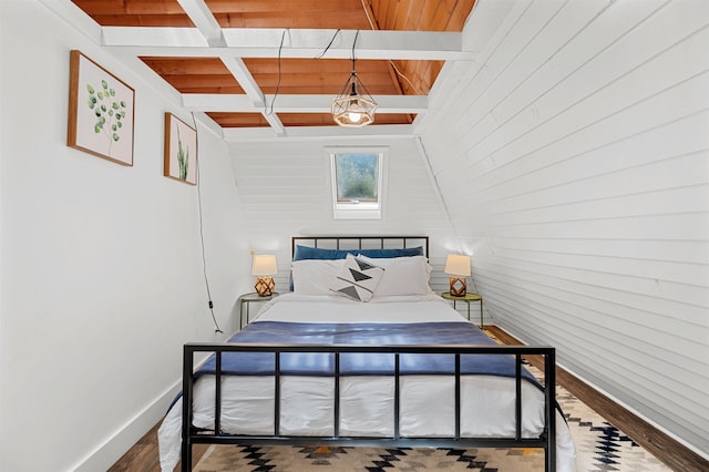 812 Airport Rd, Fayston, VT 05660 - bedroom with beam ceiling, wood finished floors, and wooden walls