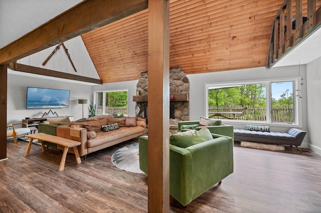 812 Airport Rd, Fayston, VT 05660 - living room featuring wood finished floors, high vaulted ceiling, a fireplace, and beamed ceiling