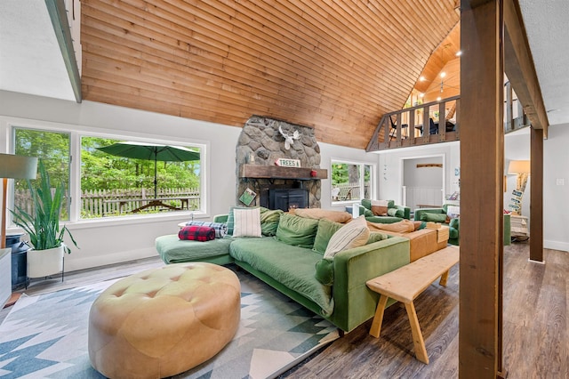 812 Airport Rd, Fayston, VT 05660 - living area with high vaulted ceiling, wood finished floors, a fireplace, and wooden ceiling