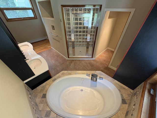 48 N Pepperell Rd, Hollis, NH 03049 - bathroom featuring a baseboard heating unit, a garden tub, a shower stall, and vanity