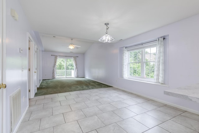 491 Mammoth Rd Unit 7, Londonderry, NH 03053 - spare room with a ceiling fan, light tile patterned floors, vaulted ceiling, and light colored carpet