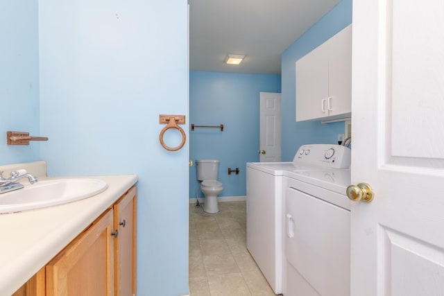 491 Mammoth Rd Unit 7, Londonderry, NH 03053 - bathroom with separate washer and dryer, tile patterned floors, and vanity