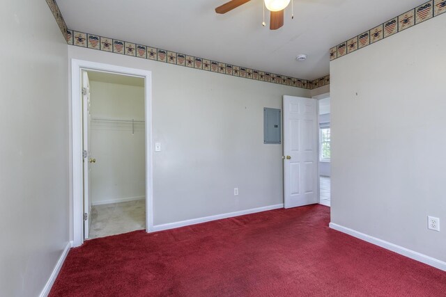 491 Mammoth Rd Unit 7, Londonderry, NH 03053 - unfurnished bedroom with carpet flooring, electric panel, a walk in closet, and a ceiling fan