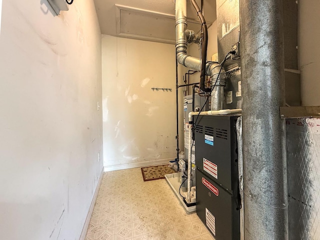 491 Mammoth Rd Unit 7, Londonderry, NH 03053 - utility room featuring heating unit