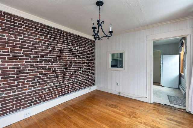 102 W Merrimack St Unit 1, Manchester, NH 03101 - unfurnished dining area with crown molding, hardwood / wood-style flooring, a chandelier, and baseboard heating