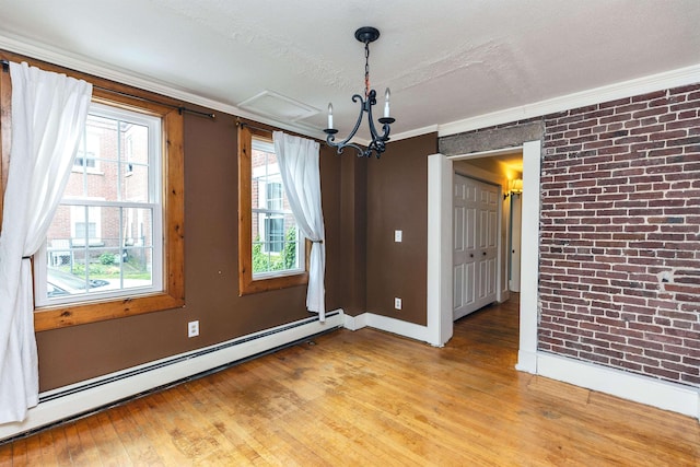 102 W Merrimack St Unit 1, Manchester, NH 03101 - unfurnished dining area with a baseboard heating unit, light wood-style flooring, brick wall, and ornamental molding