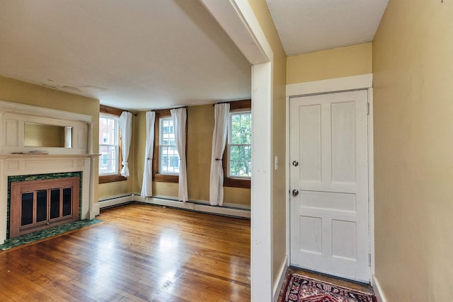 102 W Merrimack St Unit 1, Manchester, NH 03101 - foyer with hardwood / wood-style floors and a fireplace with flush hearth