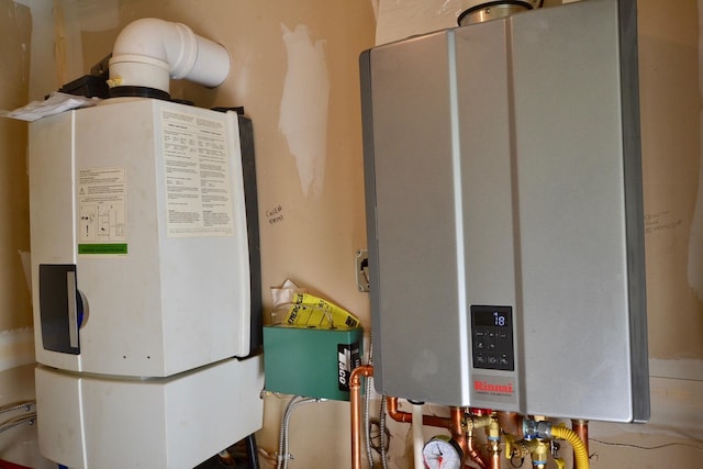 27 Randall St, Waterbury, VT 05676 - utility room with tankless water heater and water heater
