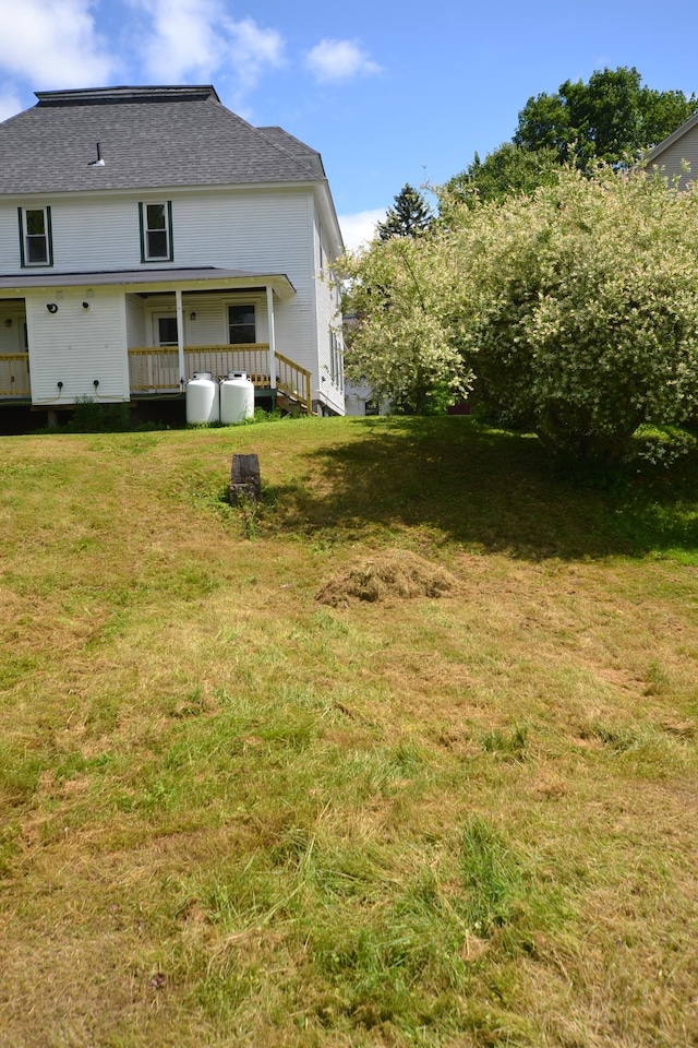 27 Randall St, Waterbury, VT 05676 - rear view of property featuring a lawn