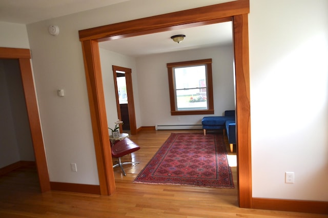 27 Randall St, Waterbury, VT 05676 - corridor with a baseboard radiator and wood finished floors