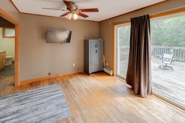 6 Goodbout Rd, Lincoln, NH 03251 - unfurnished room with light wood-style flooring, baseboard heating, ceiling fan, and ornamental molding