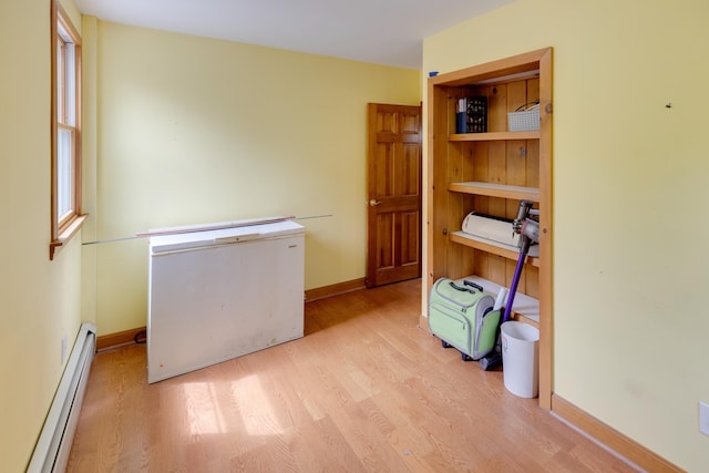 6 Goodbout Rd, Lincoln, NH 03251 - home office featuring a baseboard heating unit and wood finished floors