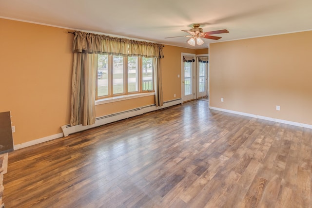 6 Goodbout Rd, Lincoln, NH 03251 - spare room featuring a baseboard radiator, ceiling fan, wood finished floors, and crown molding