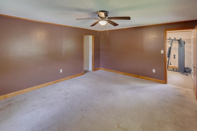 6 Goodbout Rd, Lincoln, NH 03251 - empty room with a ceiling fan, ornamental molding, carpet floors, and a textured ceiling