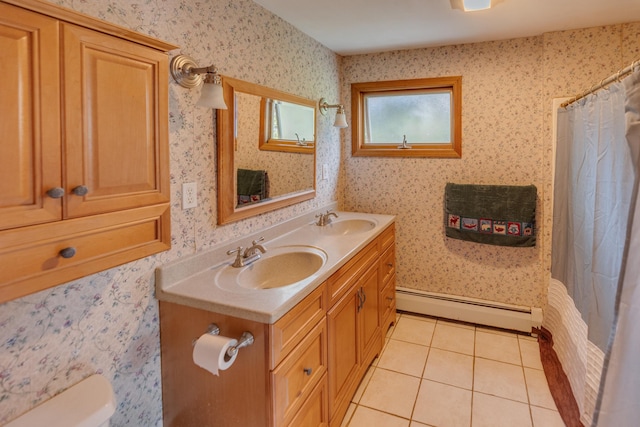 6 Goodbout Rd, Lincoln, NH 03251 - bathroom featuring baseboard heating, double vanity, tile patterned floors, curtained shower, and wallpapered walls