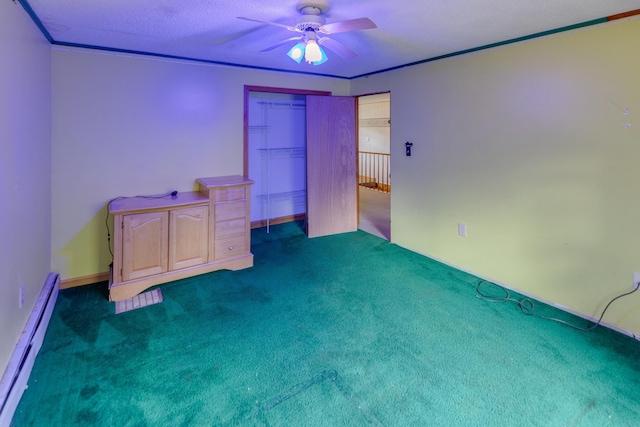 6 Goodbout Rd, Lincoln, NH 03251 - unfurnished bedroom with a baseboard heating unit, carpet flooring, a closet, ceiling fan, and ornamental molding