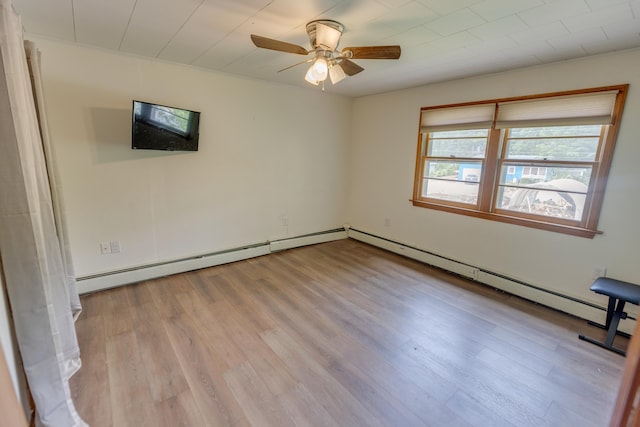 6 Goodbout Rd, Lincoln, NH 03251 - empty room with a ceiling fan, light wood-style floors, and a baseboard heating unit
